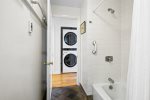 Stackable washer / dryer located in the hallway for easy access